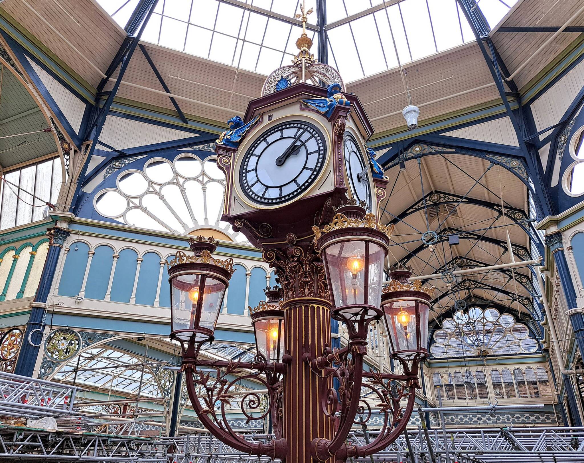 Halifax Borough Market's iconic clock underneath a newly glazed section of the roof.