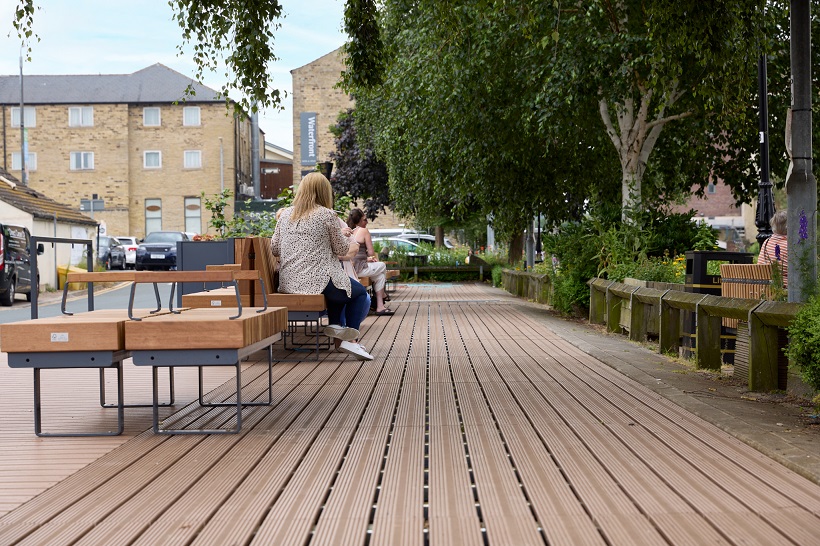 People sat on parklets at Bethel Street, Brighouse.