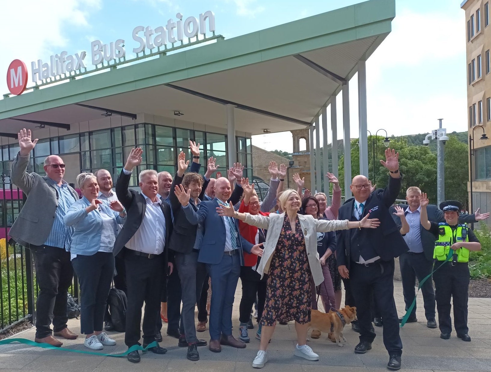 People gather to celebrate with the Mayor of West Yorkshire outside entrance to Halifax Bus Station.