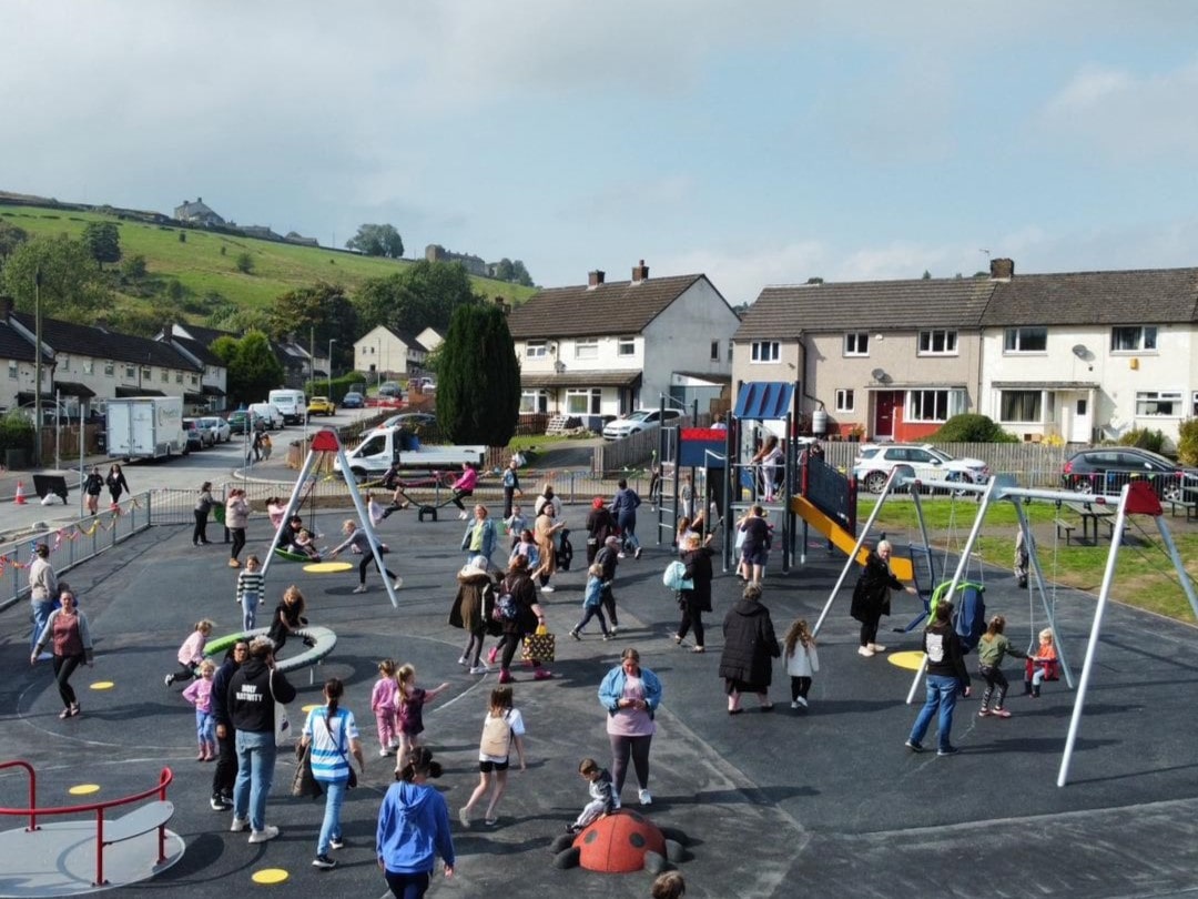 Families enjoy the new Sunny Bank playground on the opening day. 