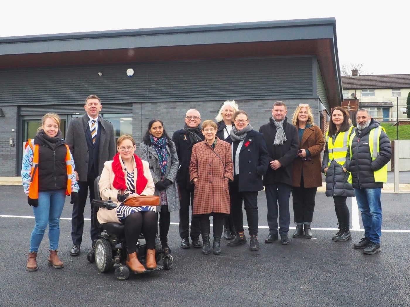 Councillors, Council officers, and representatives of the North Halifax Primary care Network, Pennine GP Alliance and Code Building Solutions outside Mixenden Community Hub.