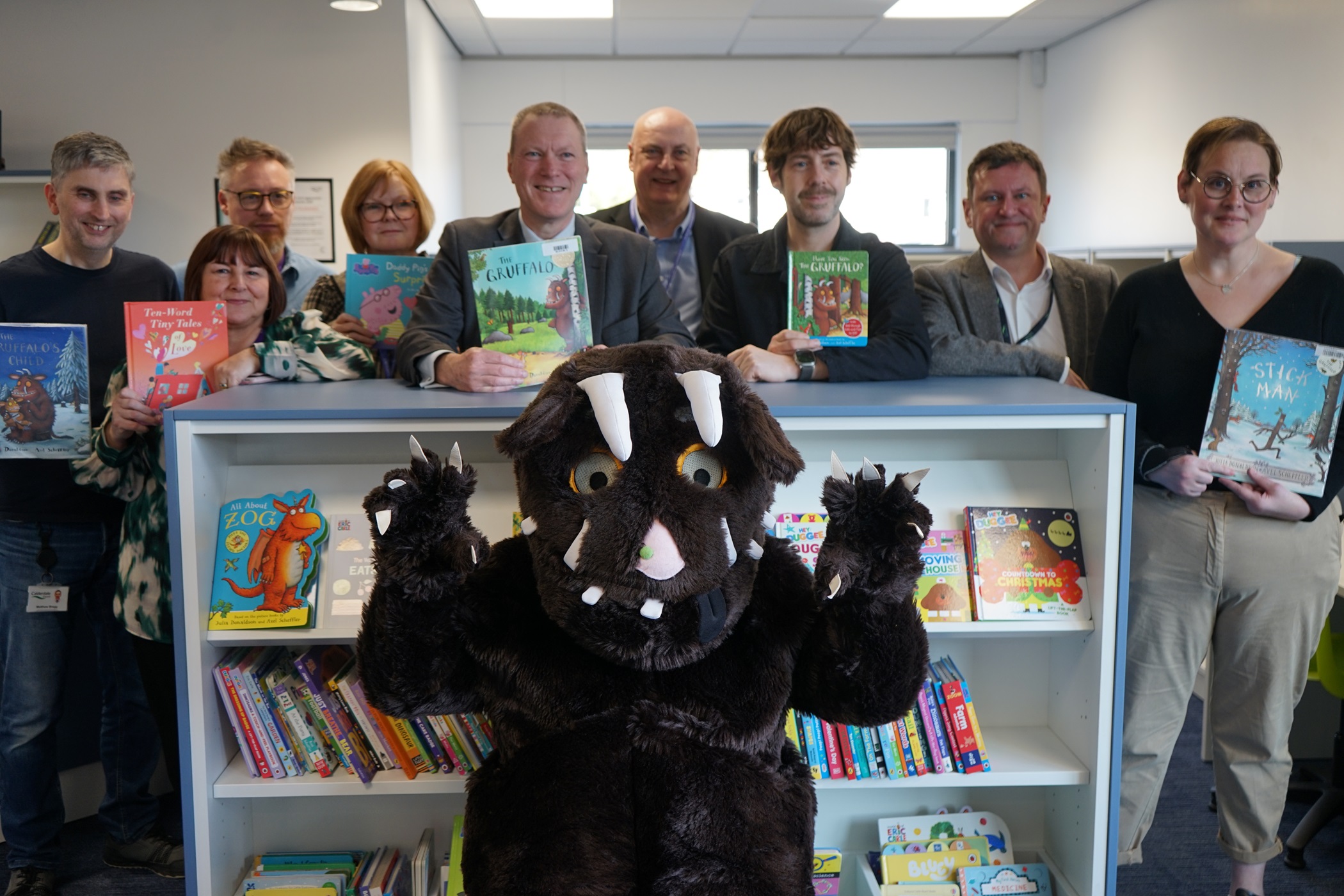 Representatives from Calderdale Council, with the Gruffalo in the new Mixenden Library.
