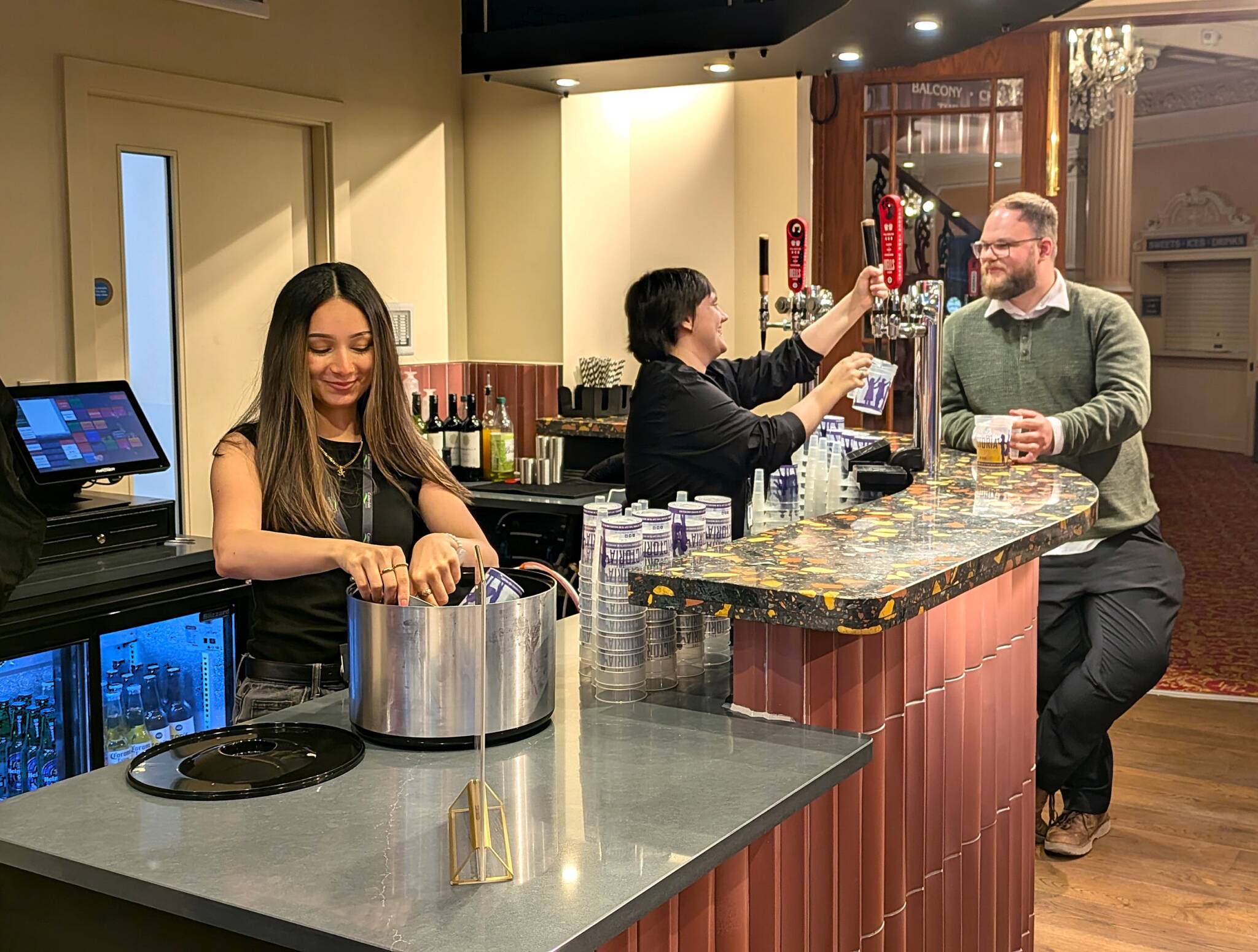 Staff serve at the new Victoria Theatre bar.