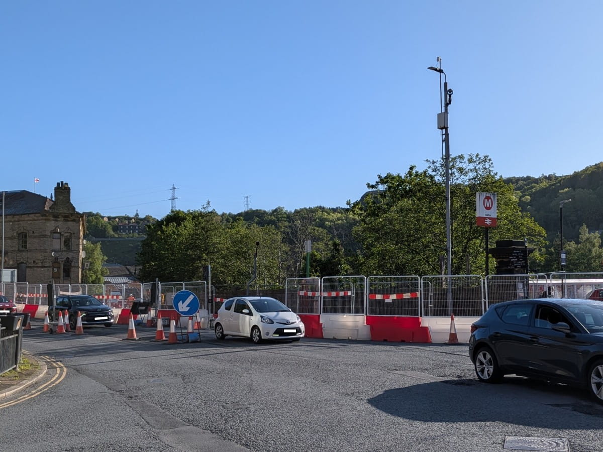 Routes open at Square Road and Church Street and access to the rail station. Construction of new road visible in the background.
