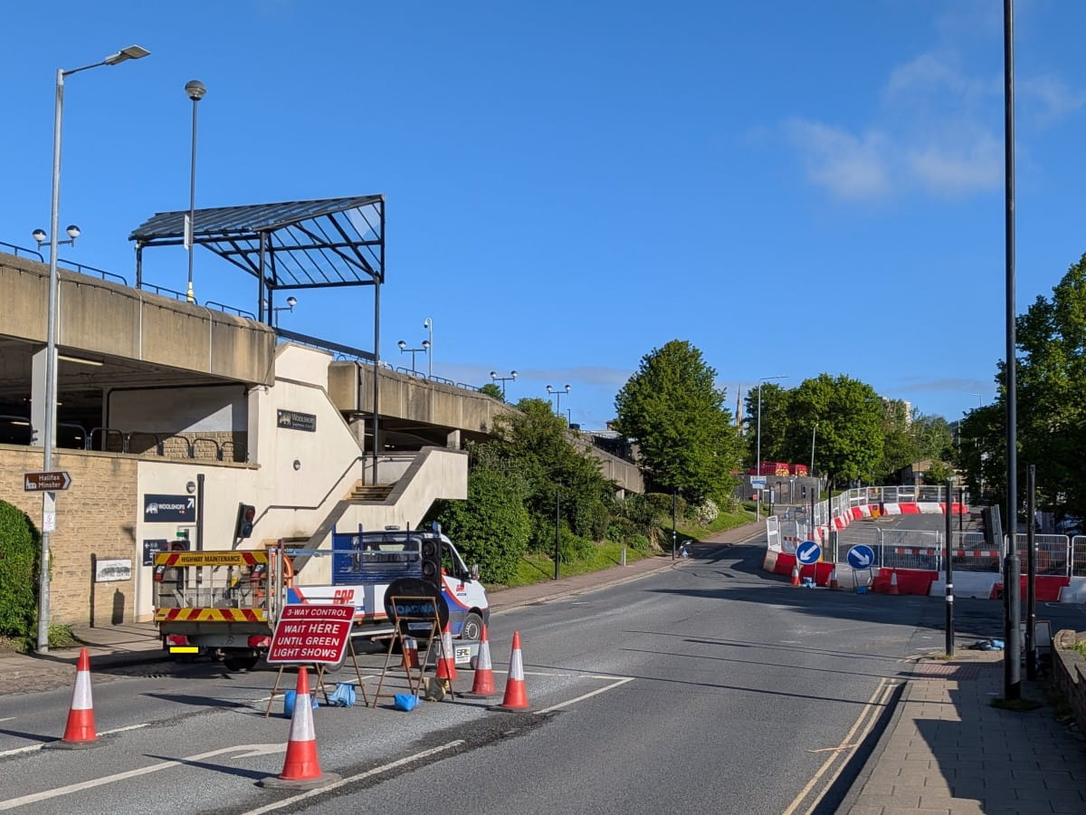 Temporary traffic signals maintain access through Charles Street.