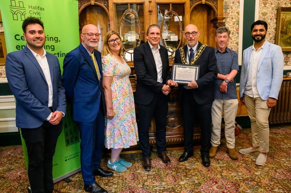 Group shot with Mayor presenting Halifax Civic Trust award to team involved with transformation of Halifax Borough Market
