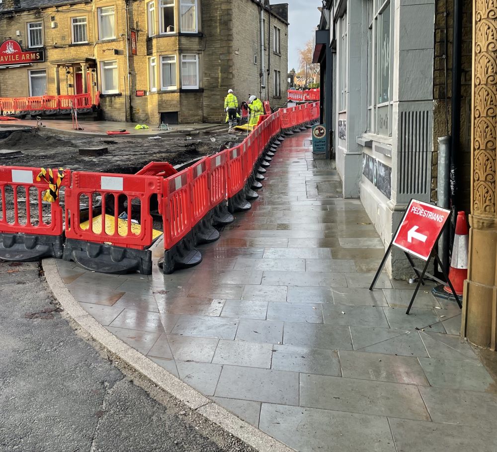New paving in place outside the Savile Arms in Elland. The carriageway has been dug up to prepare for further work.