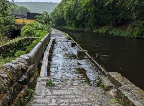 Weir on Rochdale Canal towpath.